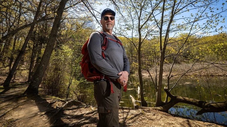 Matthew McBride, founder of Trails & Mountains, on a hiking trail